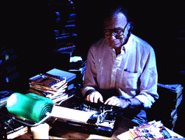 Robert Sheckley Typing at his Desk
